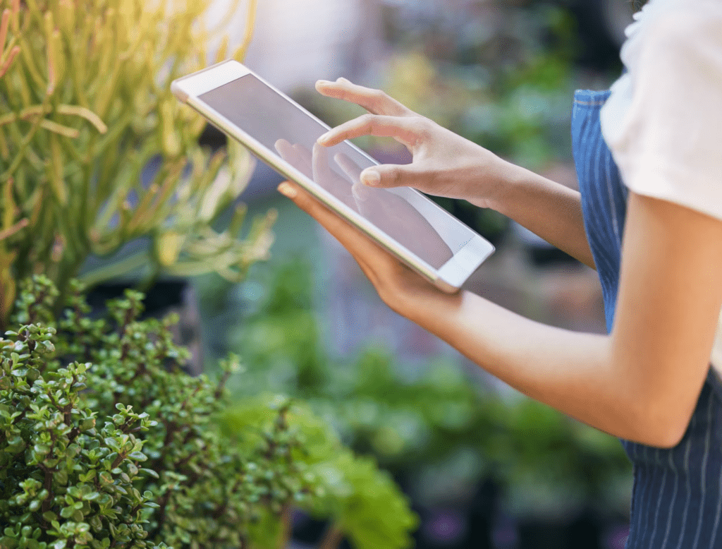 Landscape designer presenting client concepts through mobile planning app