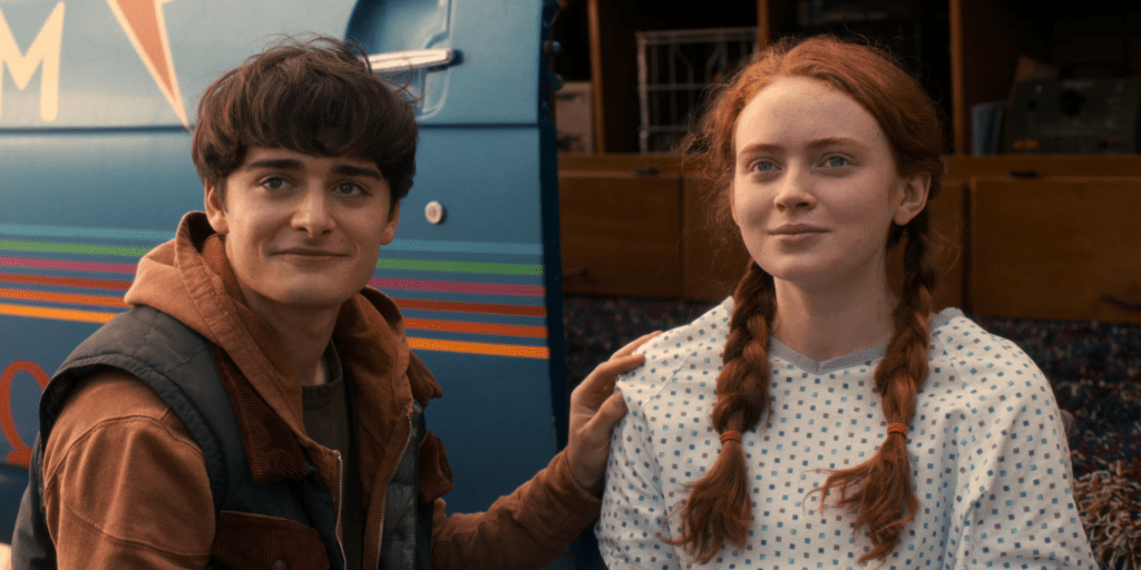 Two teenagers standing together with supportive gesture, conveying emotional ambiguity and quiet hope